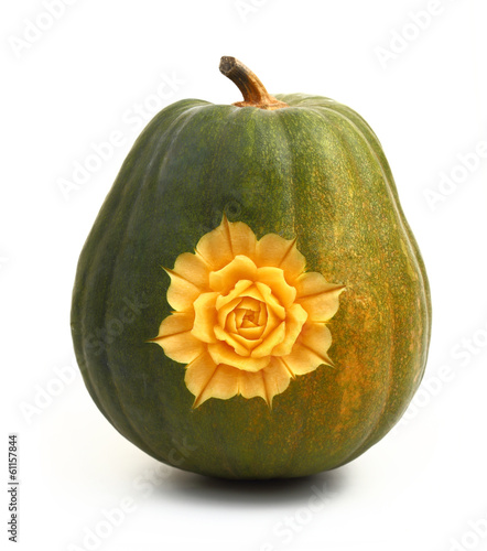 Beautifully carved flower on pumpkin isolated on white
