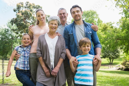 Happy extended family standing at park