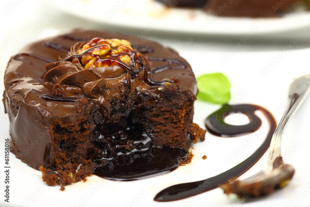 Chocolate dessert with melted chocolate running from inside Chocolate dessert with melted chocolate running from inside