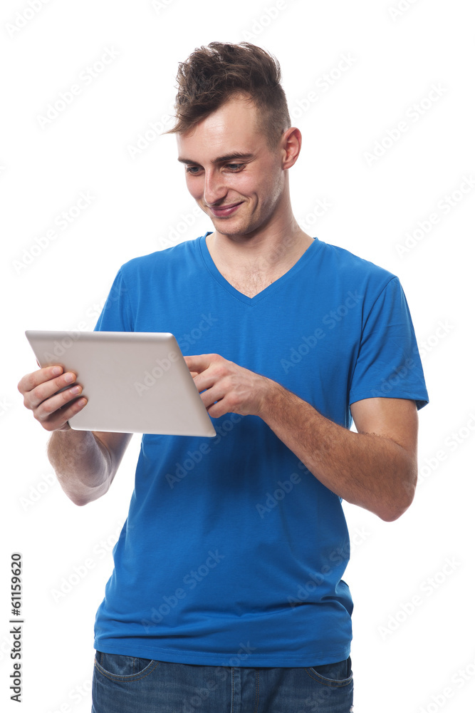 Happy young man using digital tablet Happy young man using digital tablet
