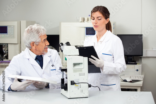 Scientists Working In Medical Laboratory
