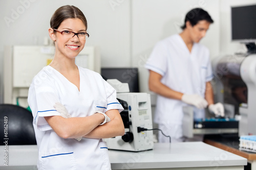 Smiling Female Scientist In Laboratory