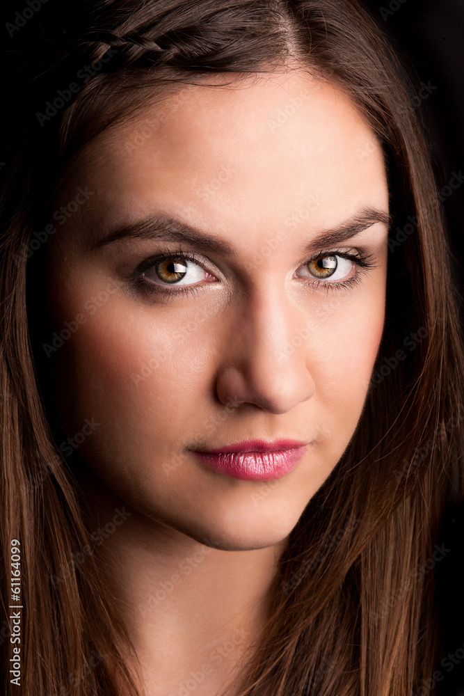Portrait of young beautiful woman with intensive look Portrait of young beautiful woman with intensive look