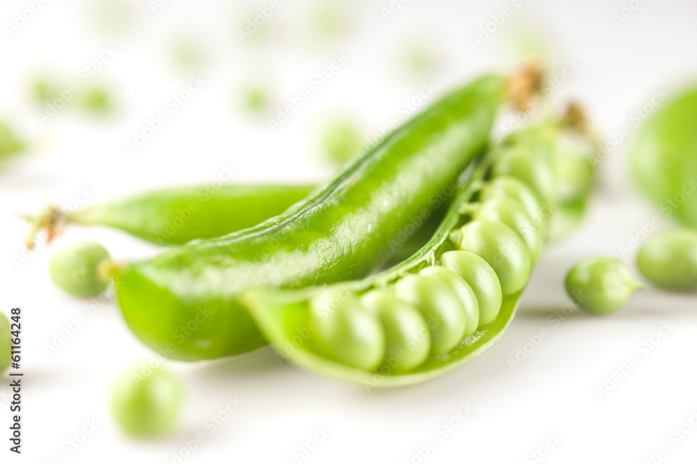 fresh green peas on white fresh green peas on white