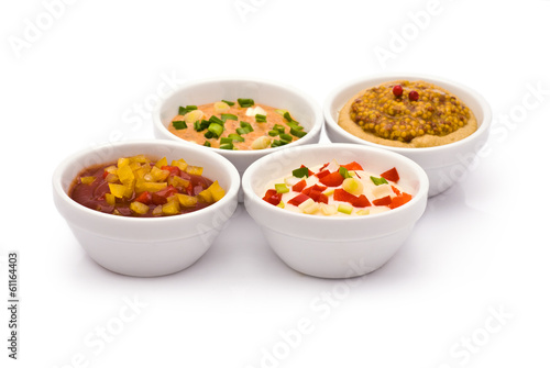 Four Colorful Sauces isolated on white