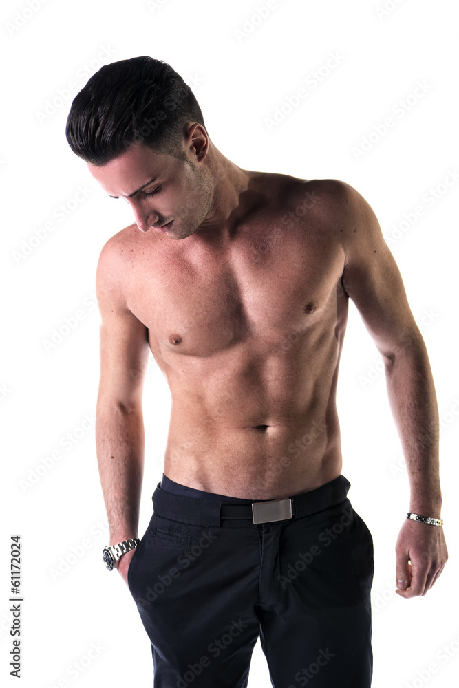 Handsome, fit young man shirtless with black pants, isolated