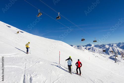 Four skiers at ski slope