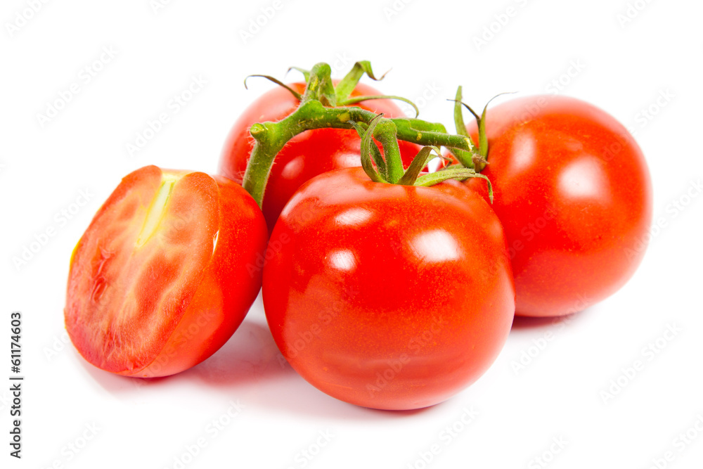 Closeup of tomatoes on the vine isolated on white. Tomato branch Closeup of tomatoes on the vine isolated on white. Tomato branch