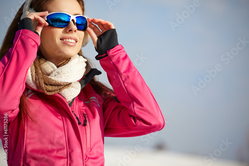 Happy smiling woman in ski goggles