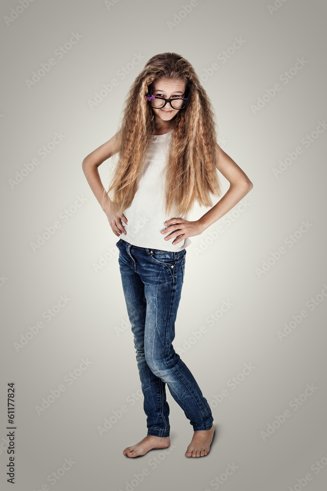 Cute smiling little teenage girl with long hair and glasses Cute smiling little teenage girl with long hair and glasses