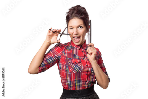 Attractive hairdresser woman with professional tools in her hand