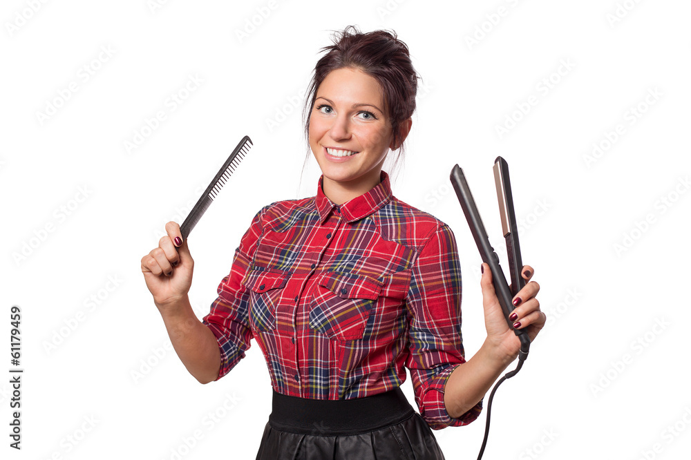 Attractive hairdresser woman with professional tools in her hand Attractive hairdresser woman with professional tools in her hand
