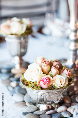 Bouquet of roses on table at wedding reception
