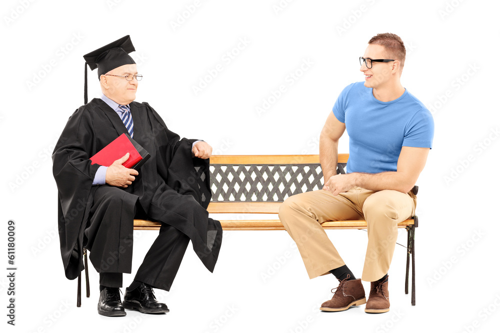 Obraz premium Young man talking to a college professor seated on bench