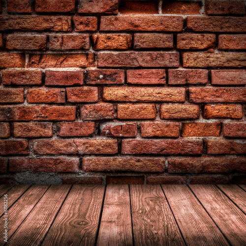 Red brick wall and wooden floor interior