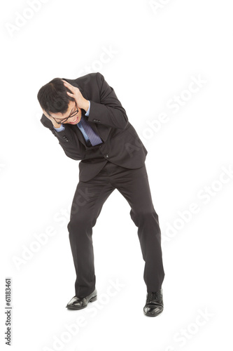 Businessmen scared to hands over his ears