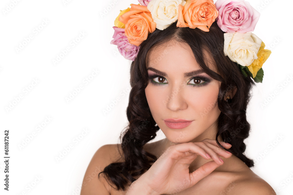 Portrait of a young woman with a wreath of roses on her head