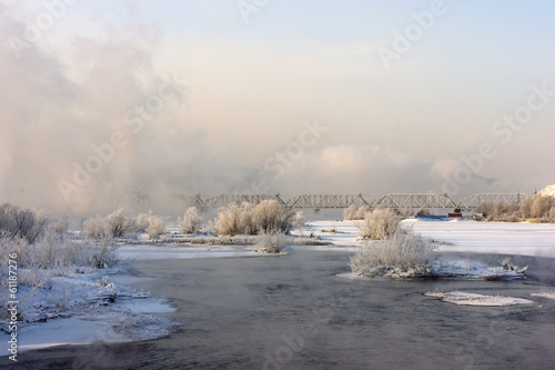 Bridge over the river in a fog