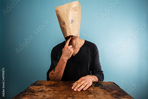 Silly man with a bag over his head