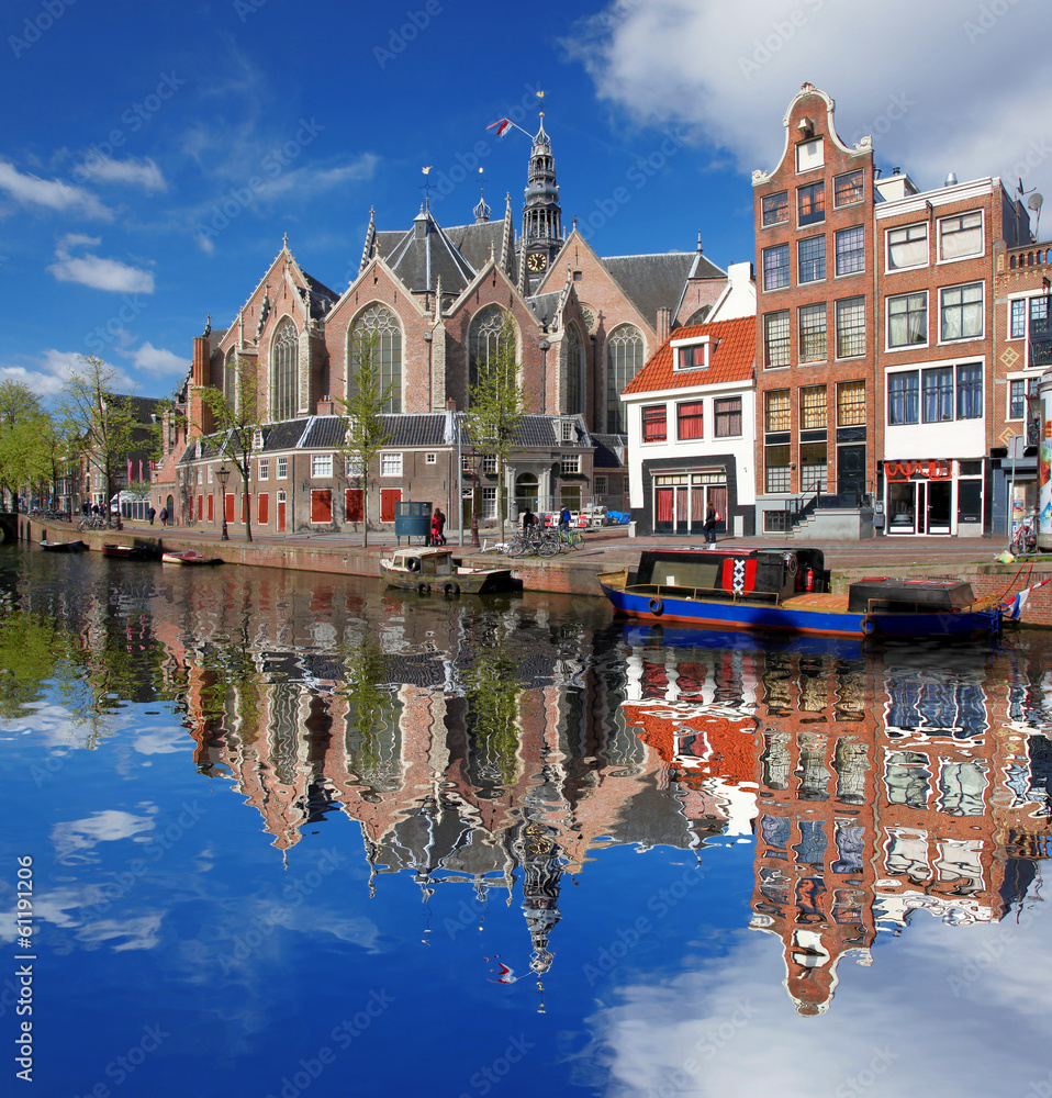 Fototapeta premium Amsterdam city with boat on canal in Holland