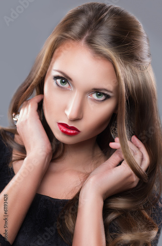 girl with red lips and chic hair. close-up portrait