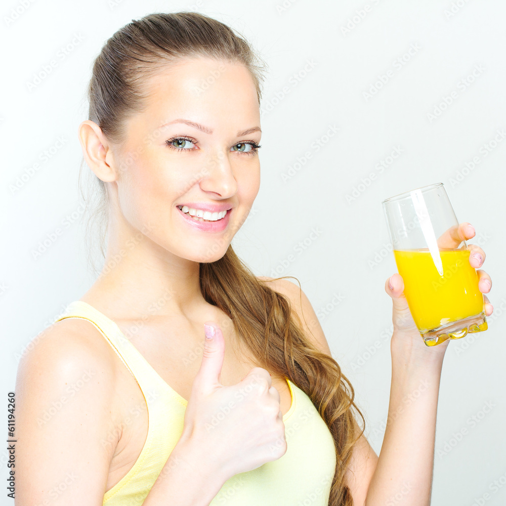 Beautiful happy smiling female with yellow orange juice. Beautiful happy smiling female with yellow orange juice.