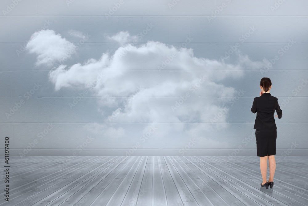Composite image of thoughtful businesswoman pointing Composite image of thoughtful businesswoman pointing