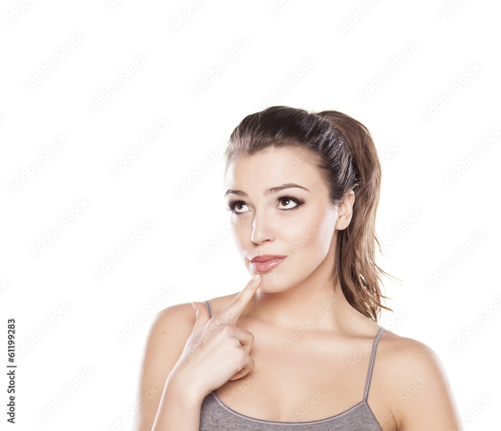thoughtful beautiful girl posing on a white background thoughtful beautiful girl posing on a white background