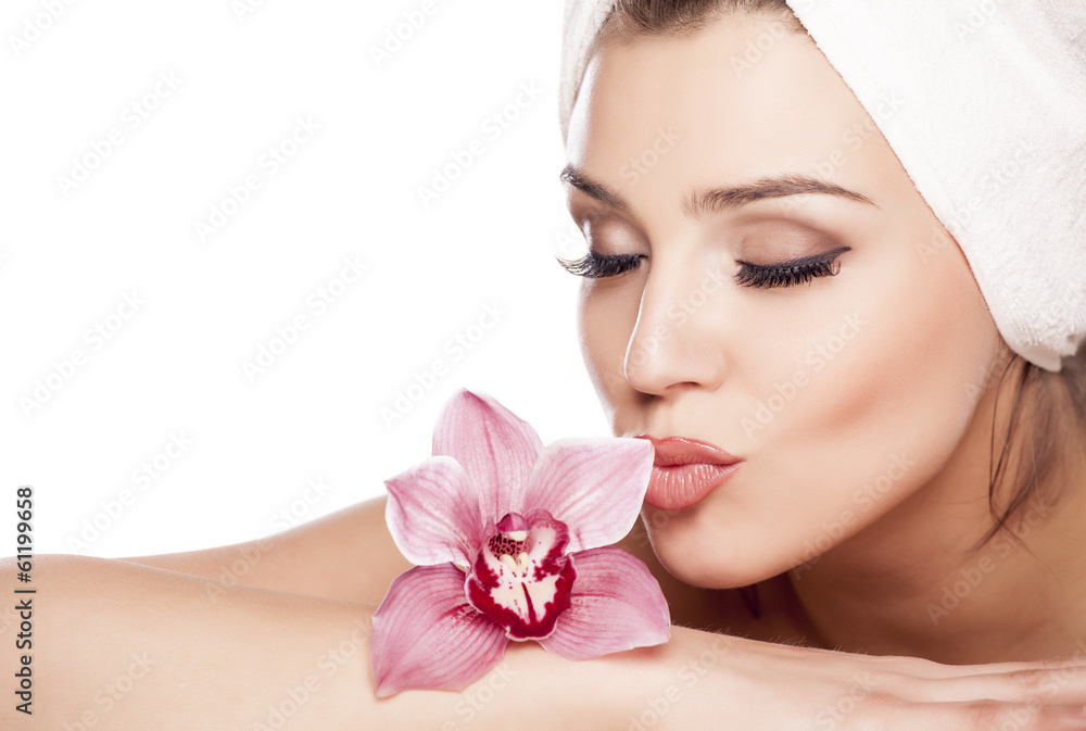 beautiful woman with a towel on her head and kissing orchid beautiful woman with a towel on her head and kissing orchid