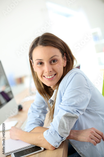 Free Download Portrait of woman in office in front of desktop - GFXLoad