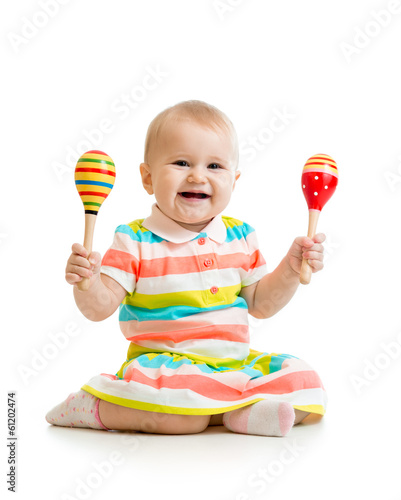 Baby girl playing with musi...