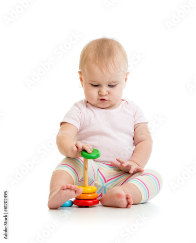 adorable baby playing with ...