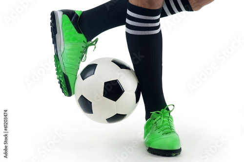 Close-up of a player's feet playing the ball