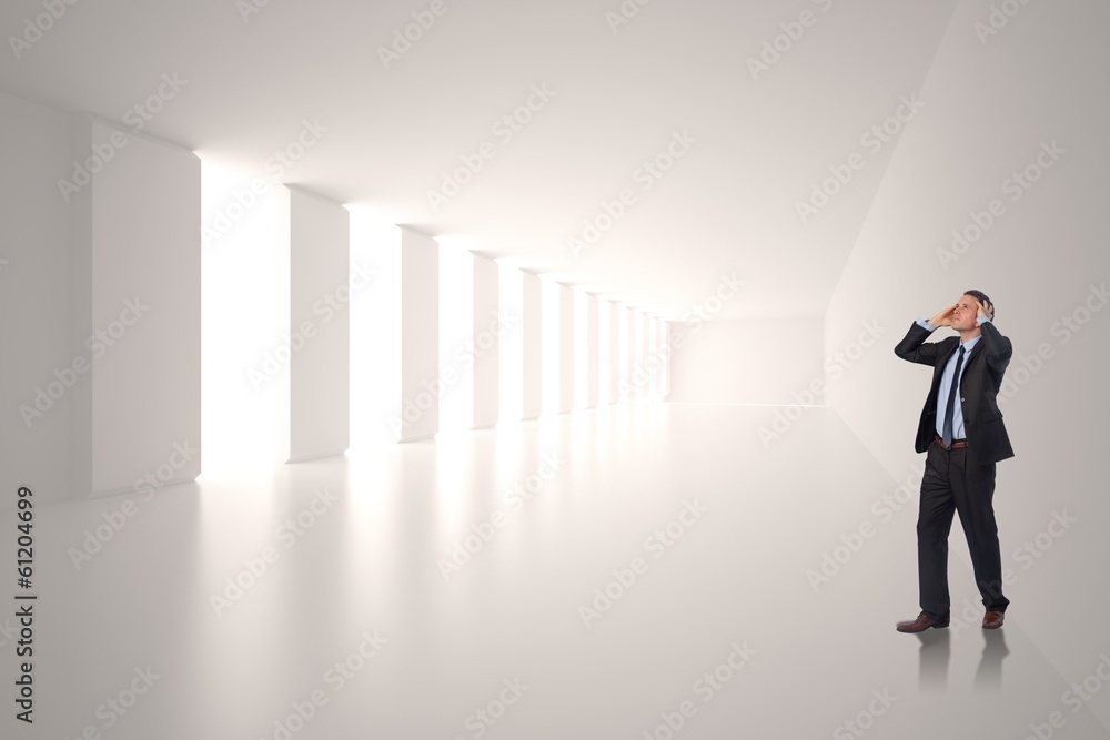 Composite image of stressed businessman with hands on head Composite image of stressed businessman with hands on head