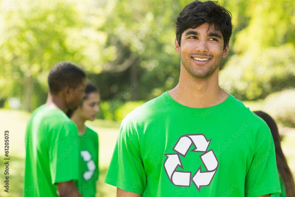 Smiling man wearing green recycling t-shirt in park Smiling man wearing green recycling t-shirt in park