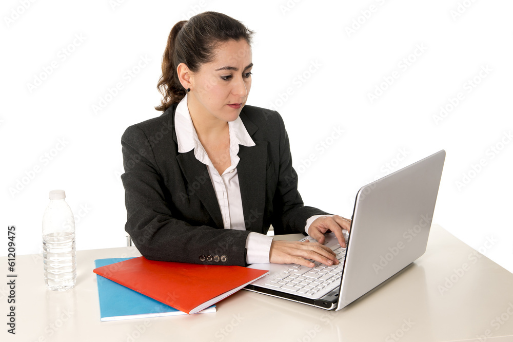 busy business woman wearing a suit working on laptop busy business woman wearing a suit working on laptop