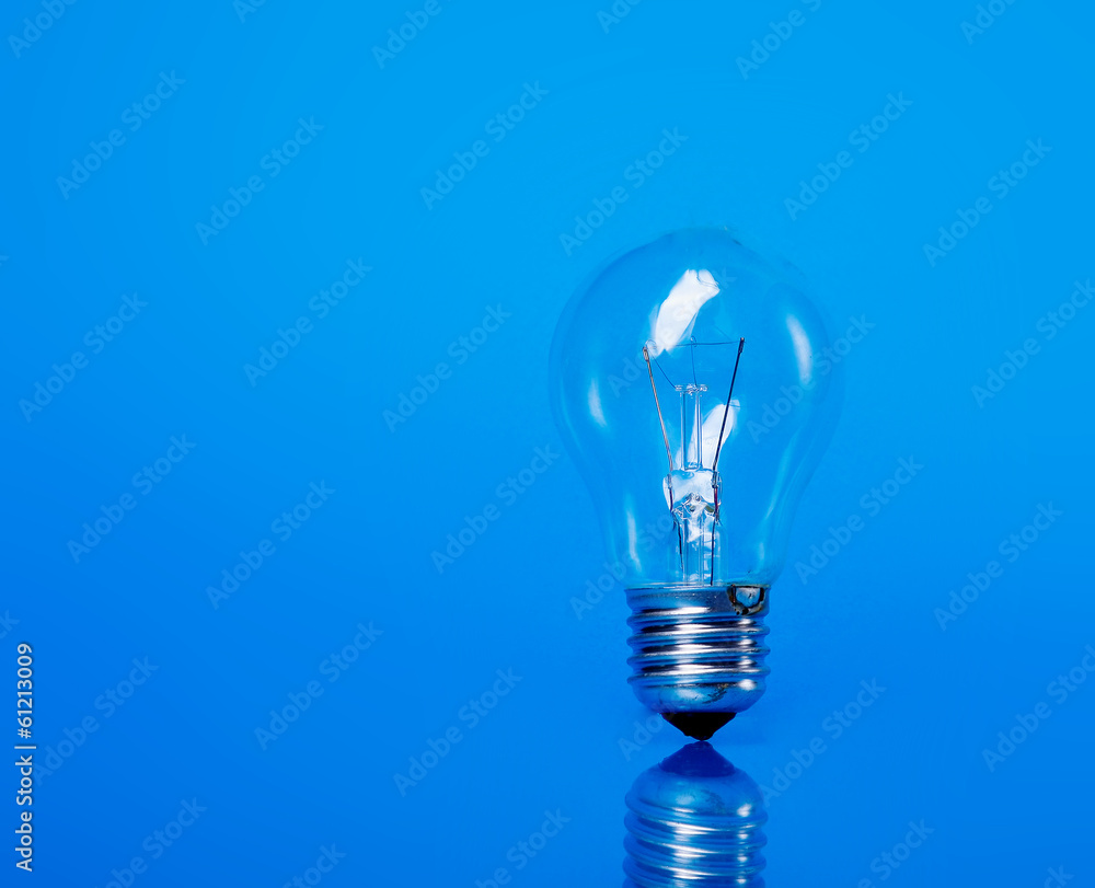 A light bulb, isolated on blue background A light bulb, isolated on blue background