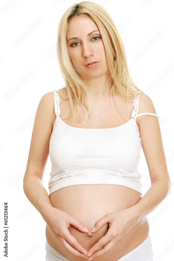 Closeup of a pregnant woman touching her belly with hands. Closeup of a pregnant woman touching her belly with hands.