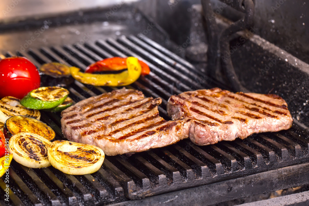 cooking a steak on the grill cooking a steak on the grill