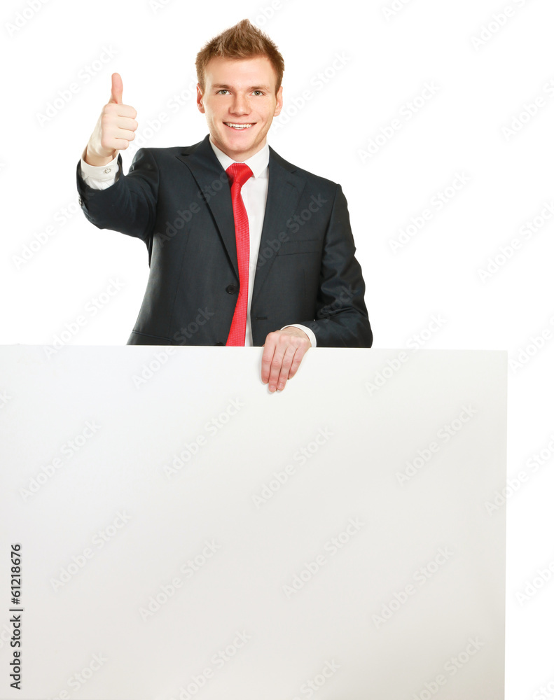 Young businessman with blank board showing thumb up Young businessman with blank board showing thumb up