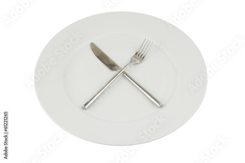 Plate with knife and fork on white