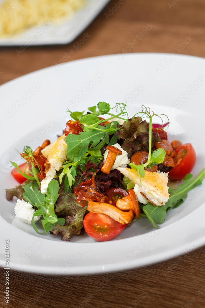 Image of tasty salad in dish in restaurant