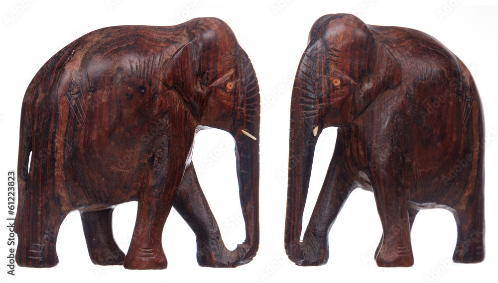 two views of wooden elephant statue isolated on white two views of wooden elephant statue isolated on white