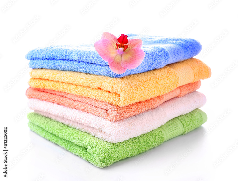 Orchid flower and towels, isolated on white Orchid flower and towels, isolated on white