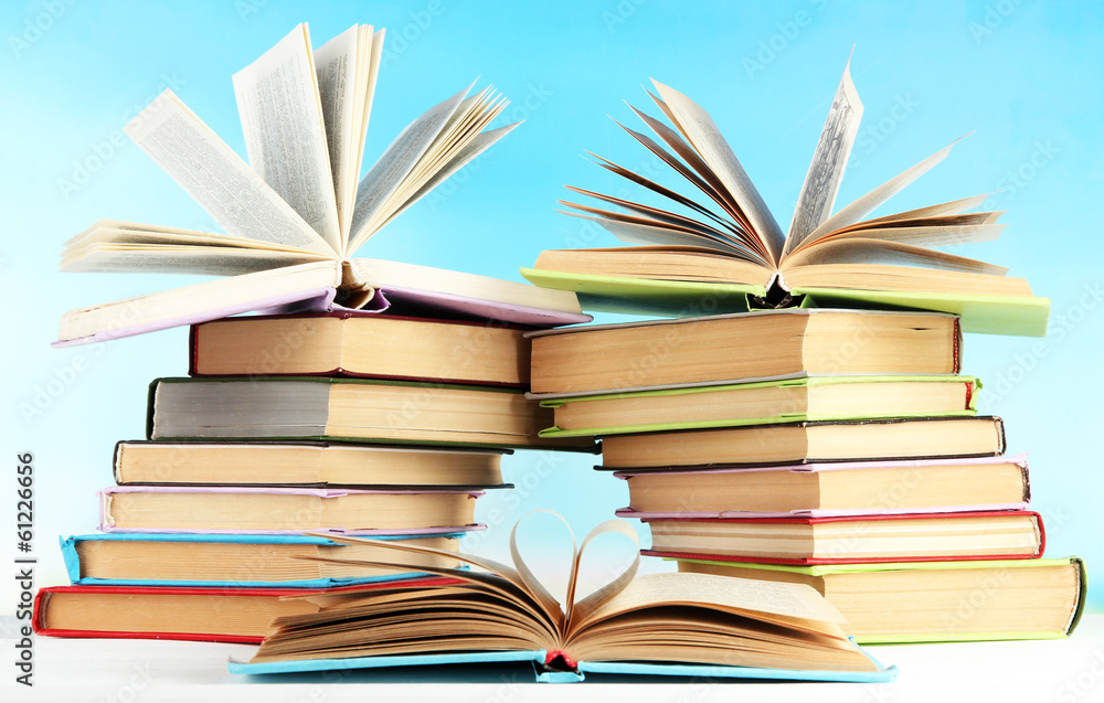 Stacks of books on table on natural background Stacks of books on table on natural background