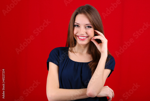 Attractive woman on color b...