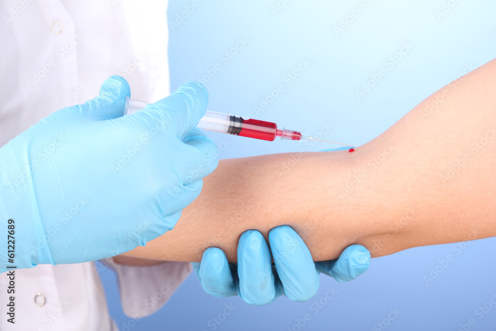 Nurse taking a blood sample, close up Nurse taking a blood sample, close up