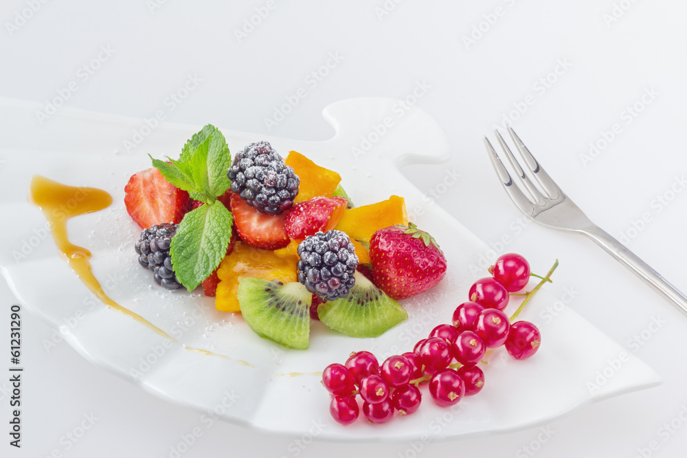 Diet, healthy colorful fruit salad in the white plate Diet, healthy colorful fruit salad in the white plate