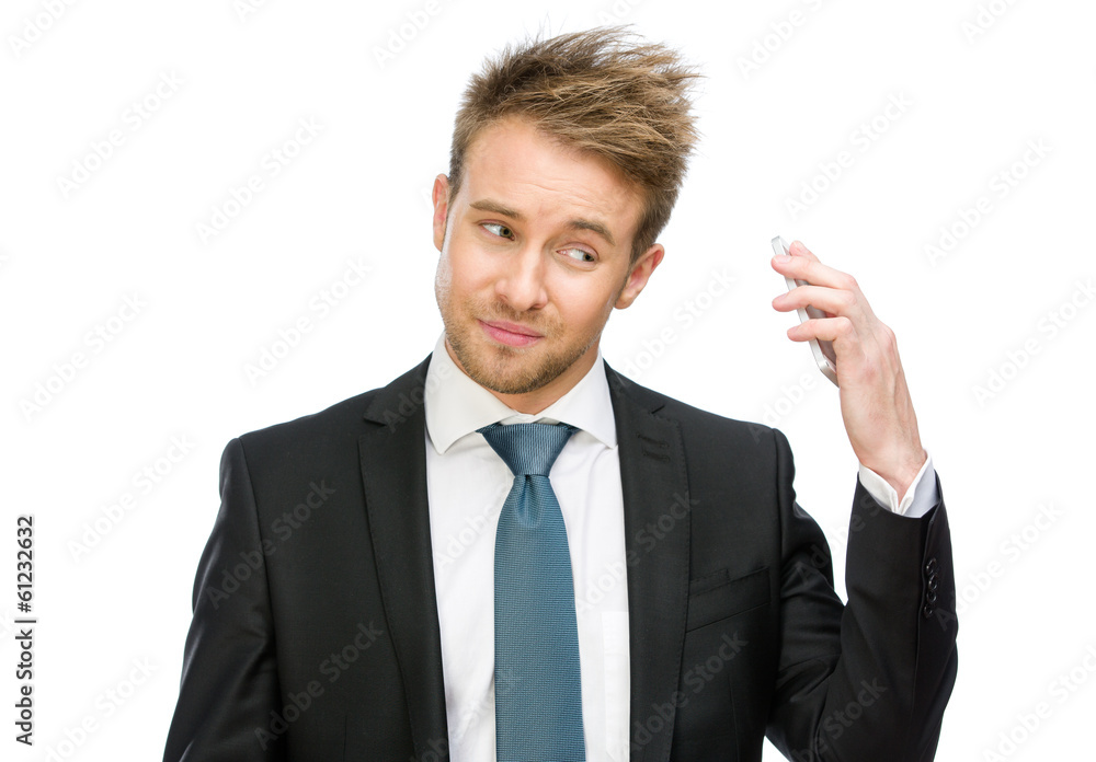 Half-length portrait of businessman keeping cell phone Half-length portrait of businessman keeping cell phone