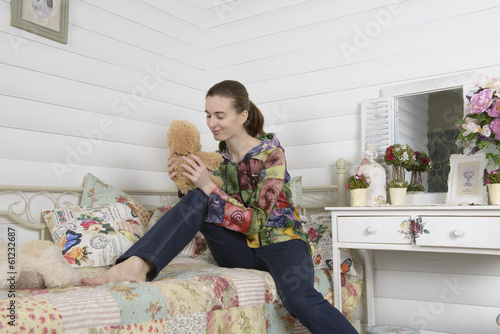 Portrait of a young woman in an interior children's room